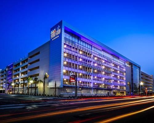 Exterior photo of Baptist parking structure at night.